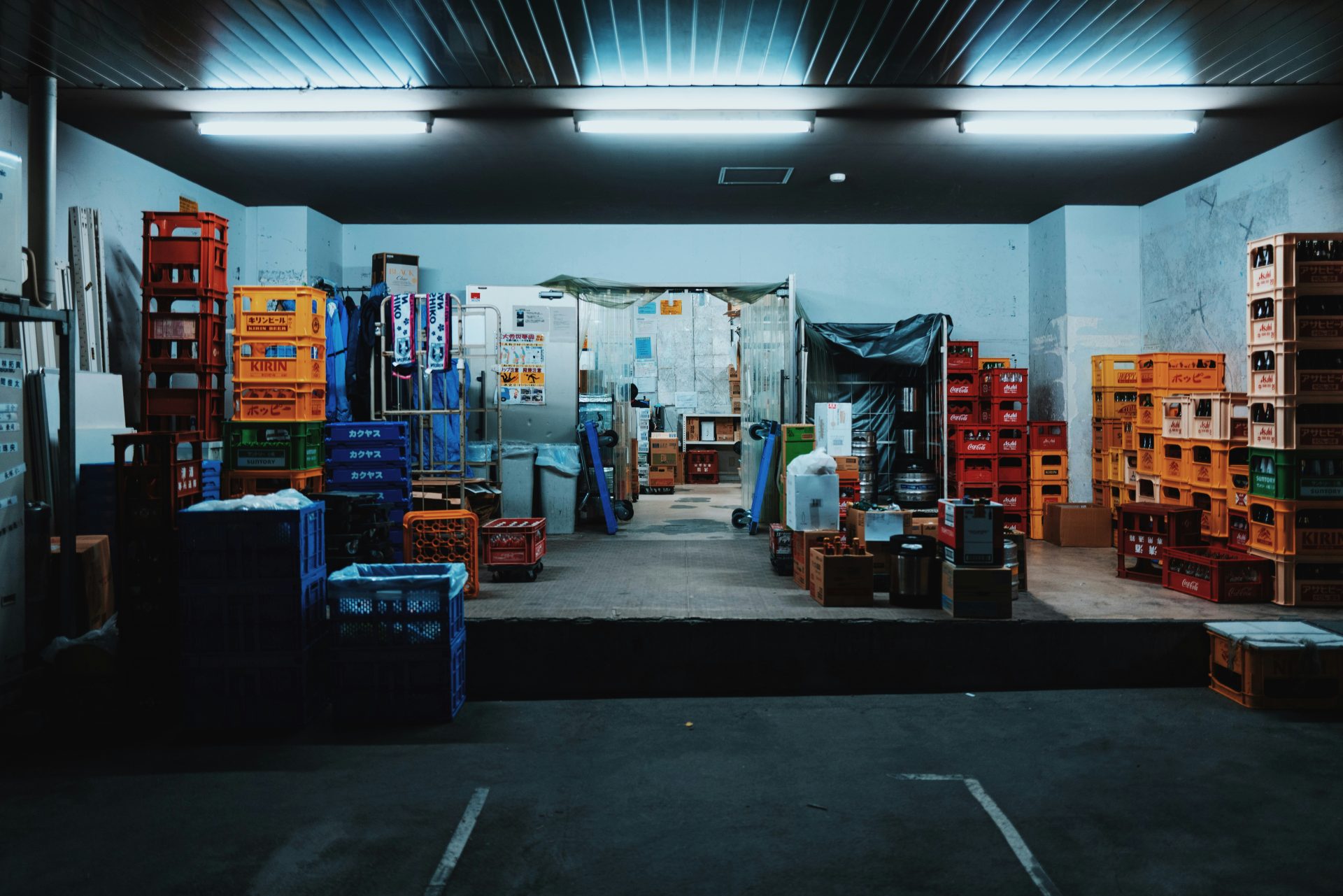 landscape photography of plastic crates in a garage