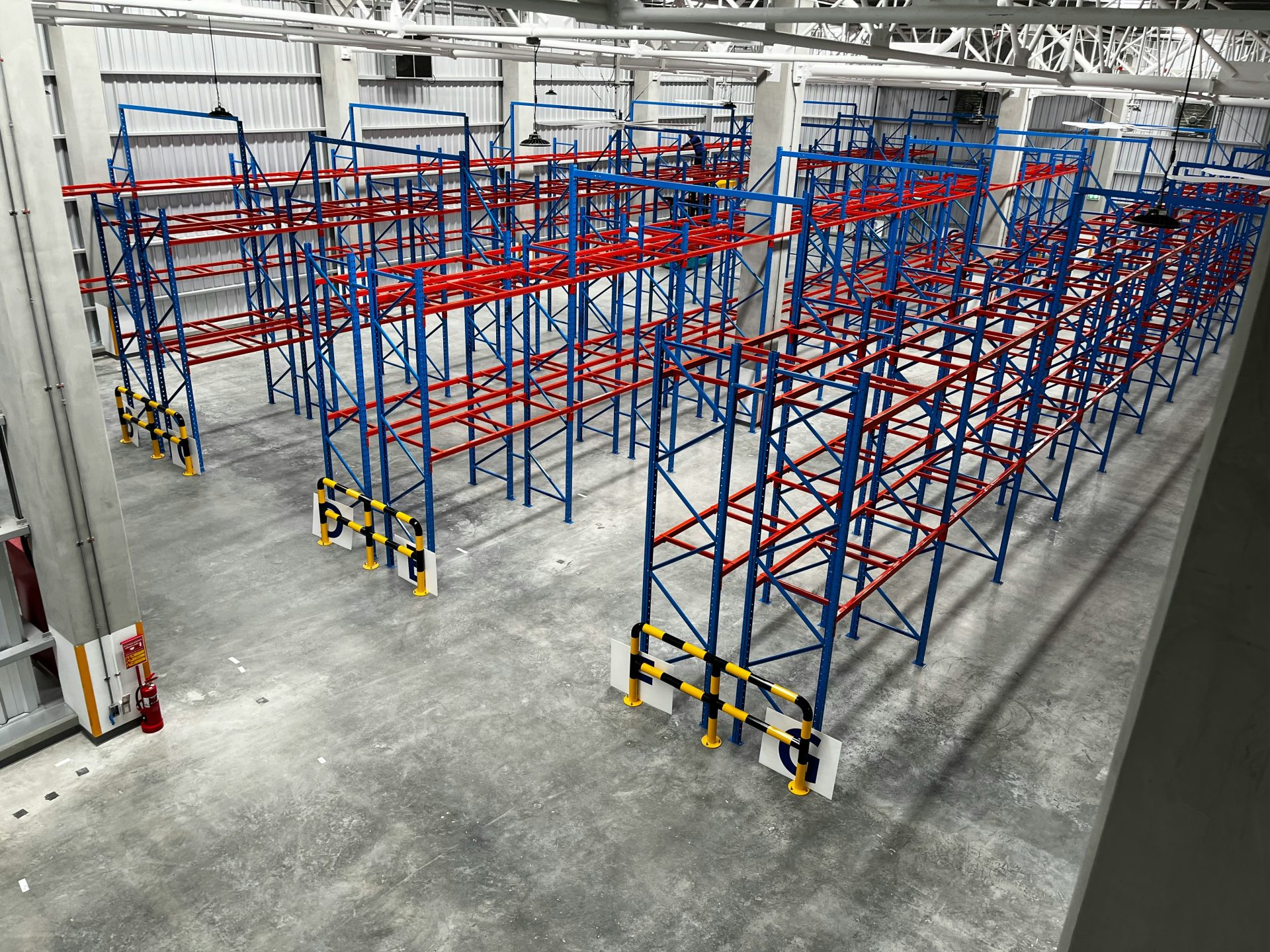 a large room with blue and yellow bars